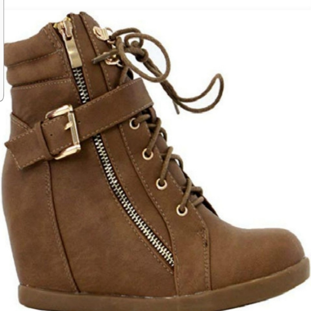 Womens lace up fashion high top sneaker boots.